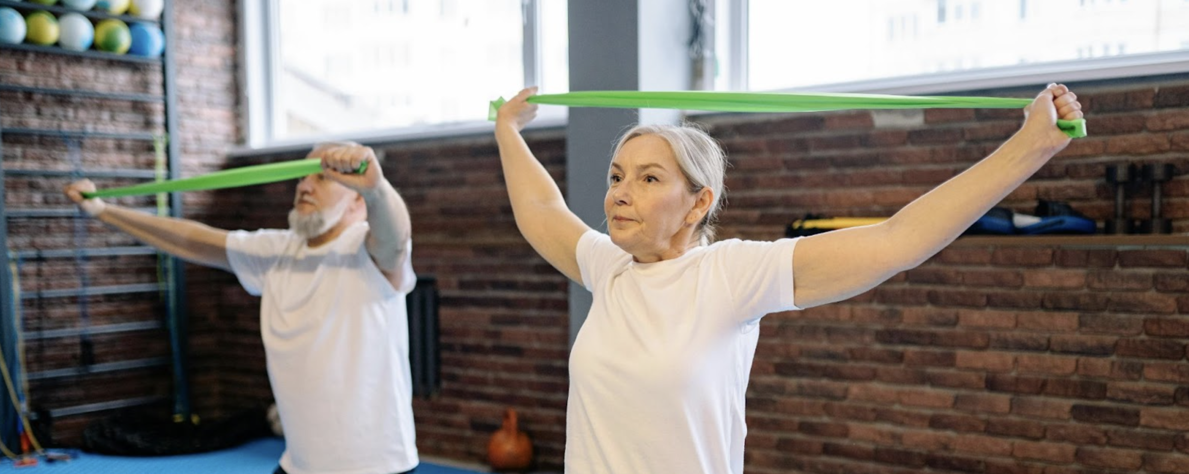 Seniors exercising with resistance bands